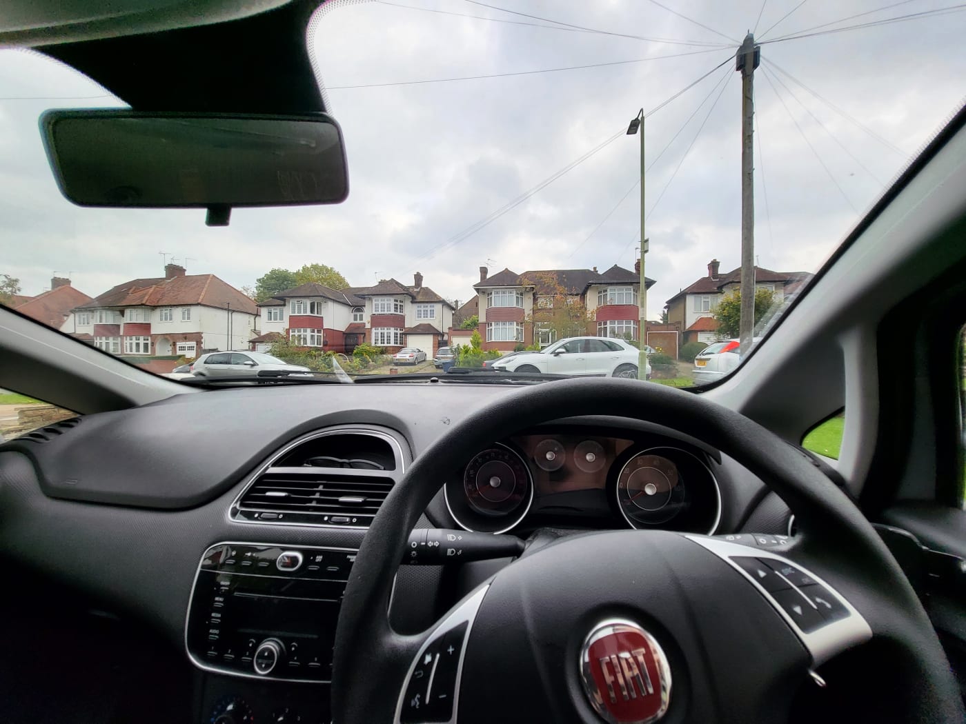 first person view of sitting in the drivers seat of a car