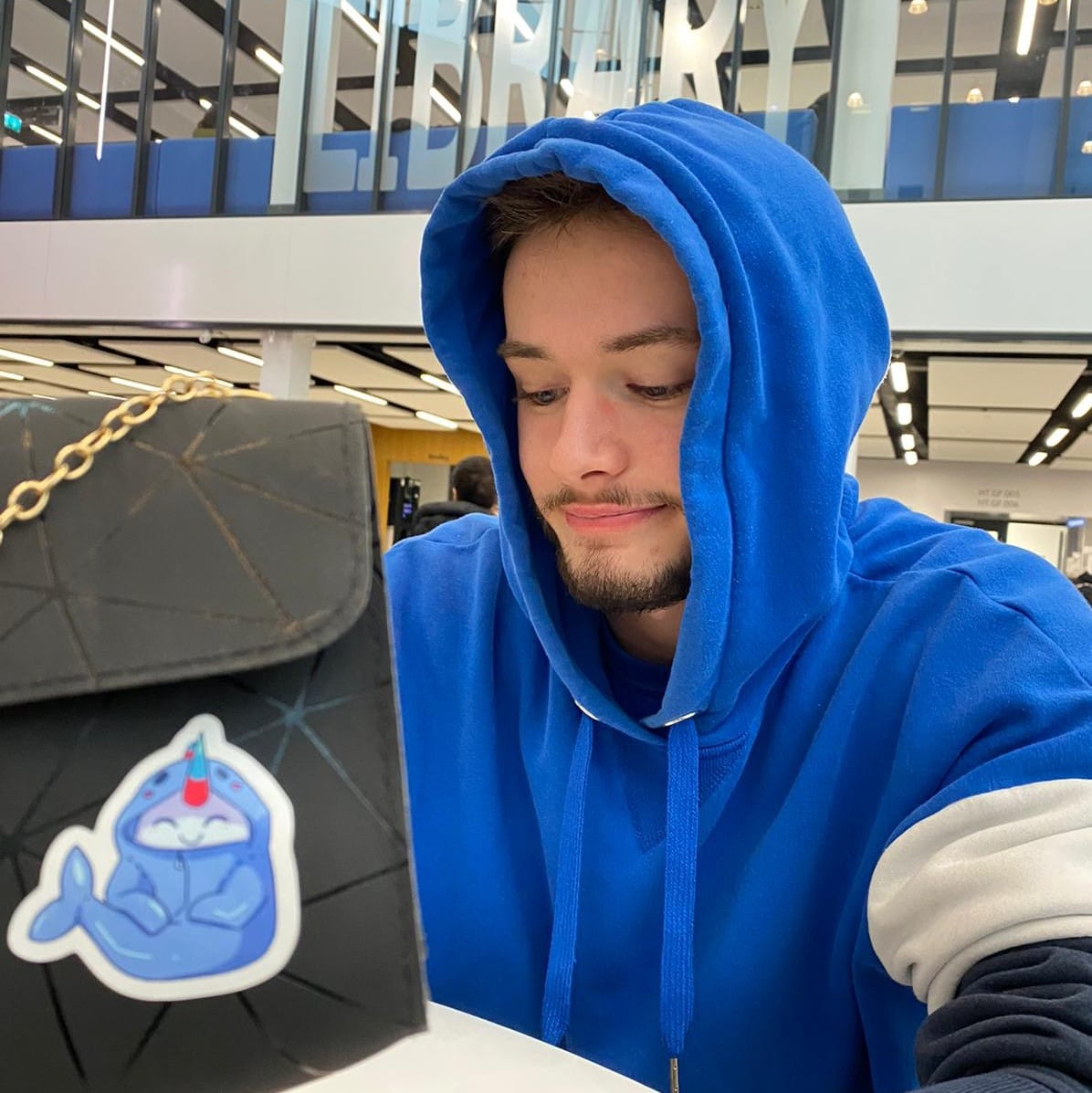 picture of a man in a blue hoodie