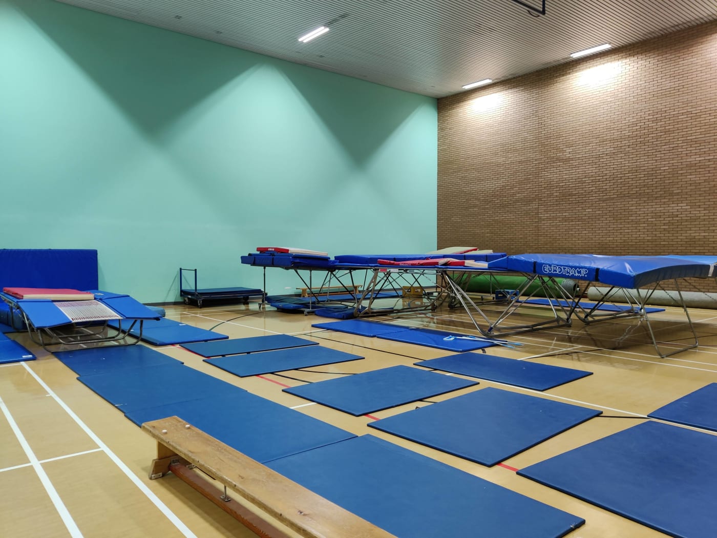 a sports hall with trampolines in it